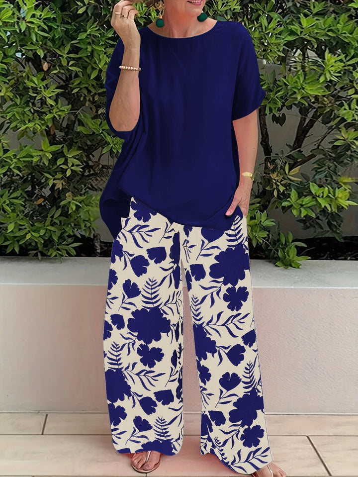 Ensemble élégant Lina de Danoir Paris en tissu bleu avec détails sophistiqués, porté sur un mannequin.