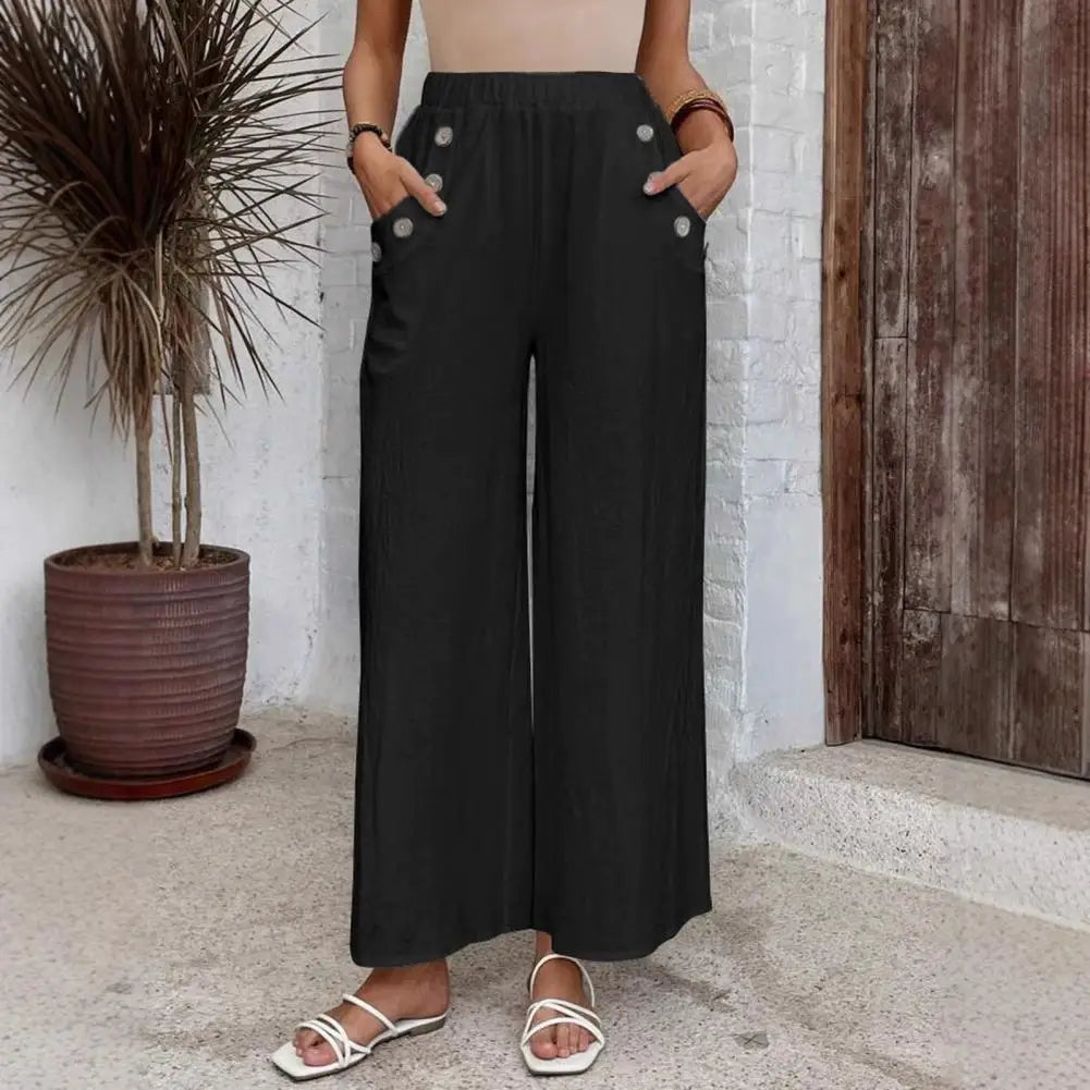 Pantalon large Rhea de Danoir Paris en tissu bleu marine, coupe décontractée et moderne, vue de face.