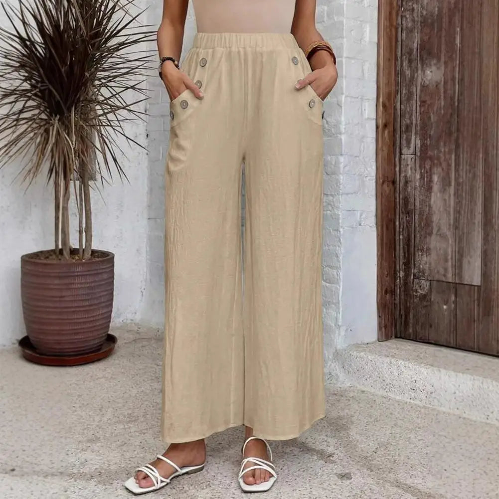 Pantalon large Rhea de Danoir Paris en tissu bleu marine, vue de face, avec coupe ample et détails élégants.