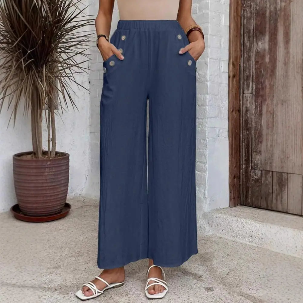 Pantalon large Rhea de Danoir Paris en tissu bleu marine, coupe confortable et élégante pour femme.