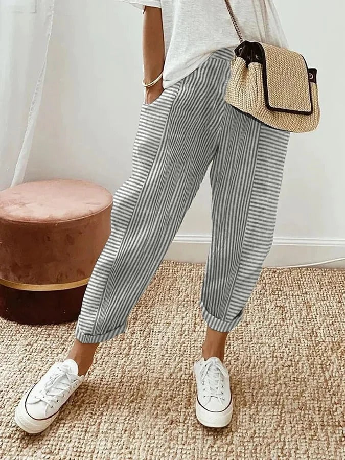 Pantalon rayé Jade de Danoir Paris en tissu bleu et blanc, coupe ajustée, taille XS.