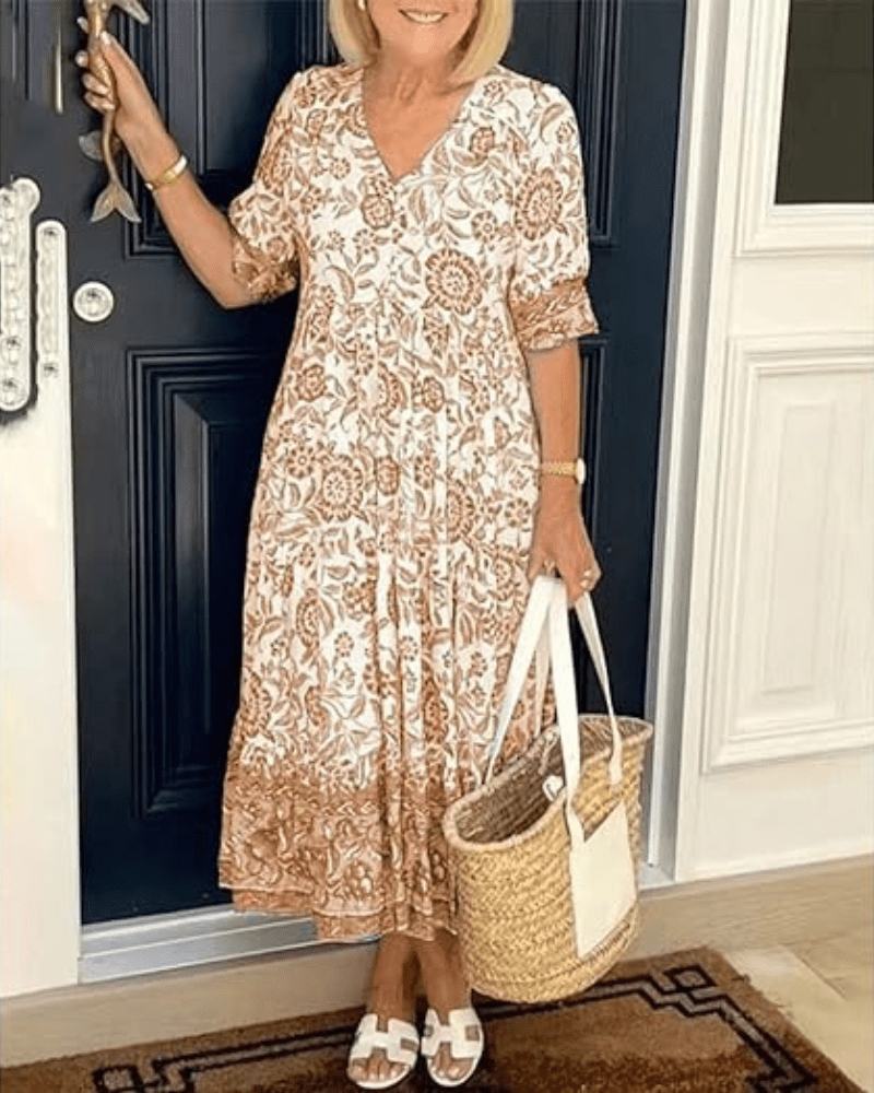 Robe d'été élégante Danoir Paris Manelle en tissu bleu léger, manches courtes et coupe fluide pour femme.