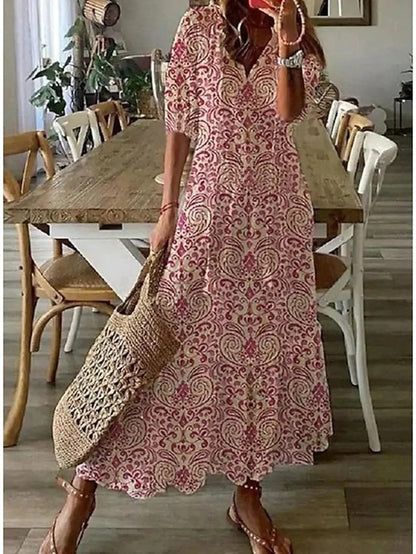 Robe bohémienne légère Dianna de Danoir Paris, en tissu fluide bleu, avec détails fluides et élégants.
