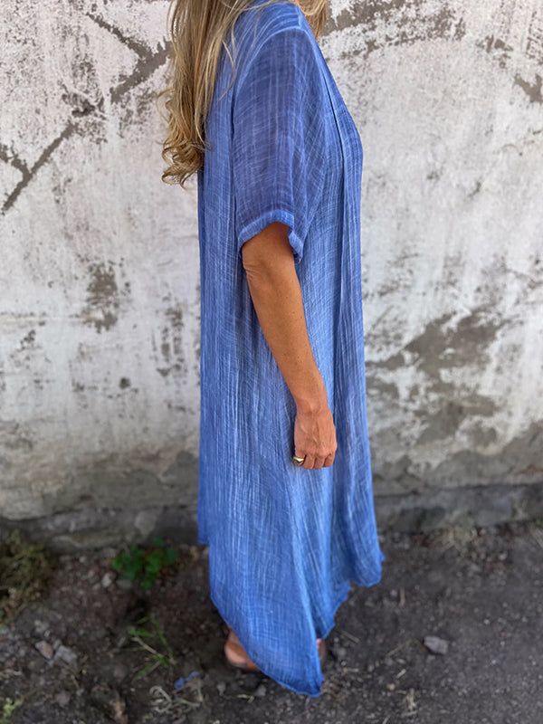 Robe écologique Danoir Paris Malaga bleue élégante, courte, avec manches longues et design sophistiqué.