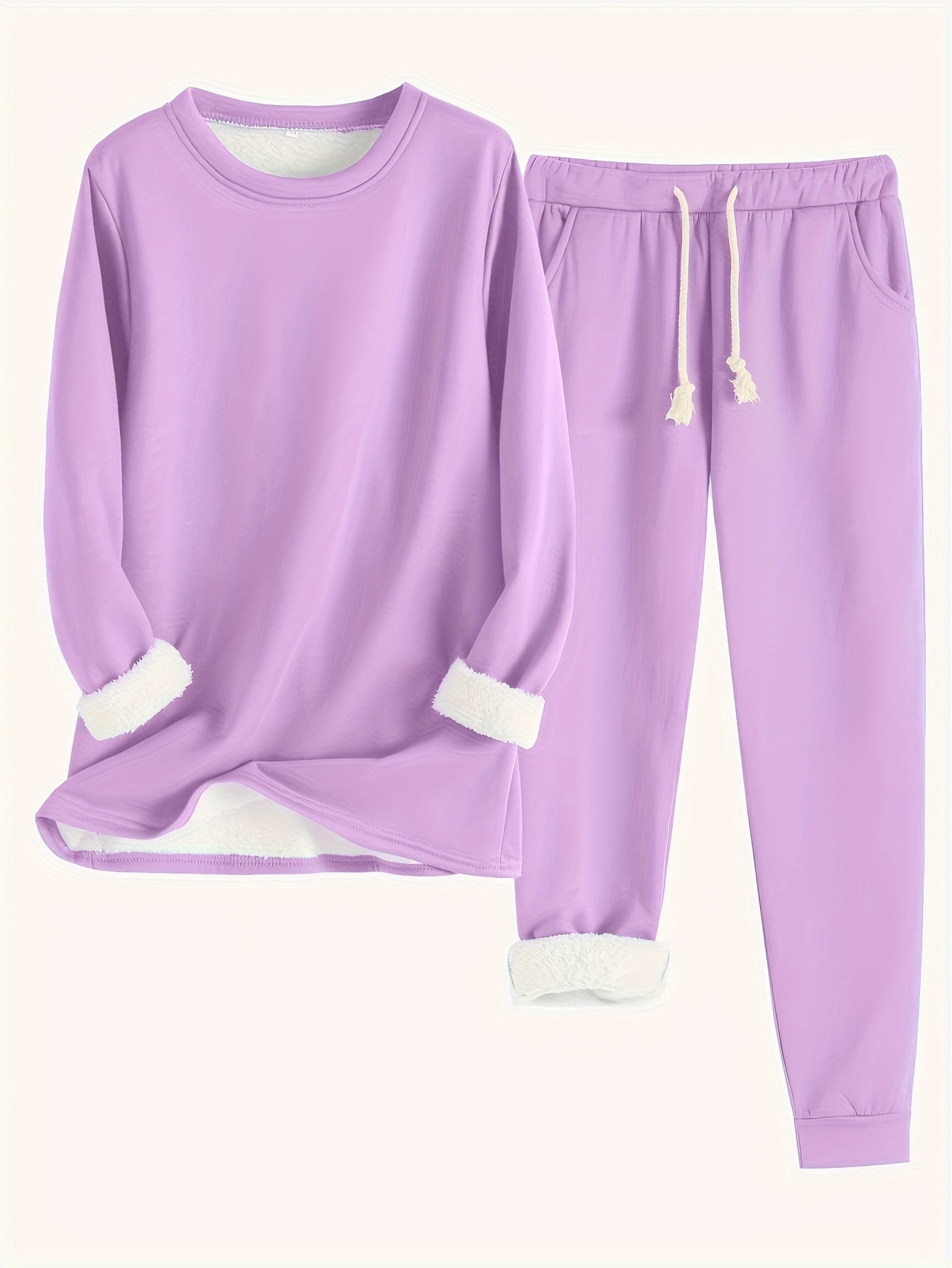 Ensemble de loungewear chic Rebecca de Danoir Paris en tissu bleu, comprenant un haut et un pantalon confortables.