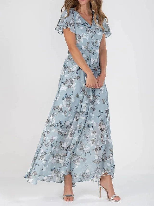 Robe maxi fleurie élégante Danoir Paris, en tissu léger, avec motif floral, parfaite pour une occasion chic.