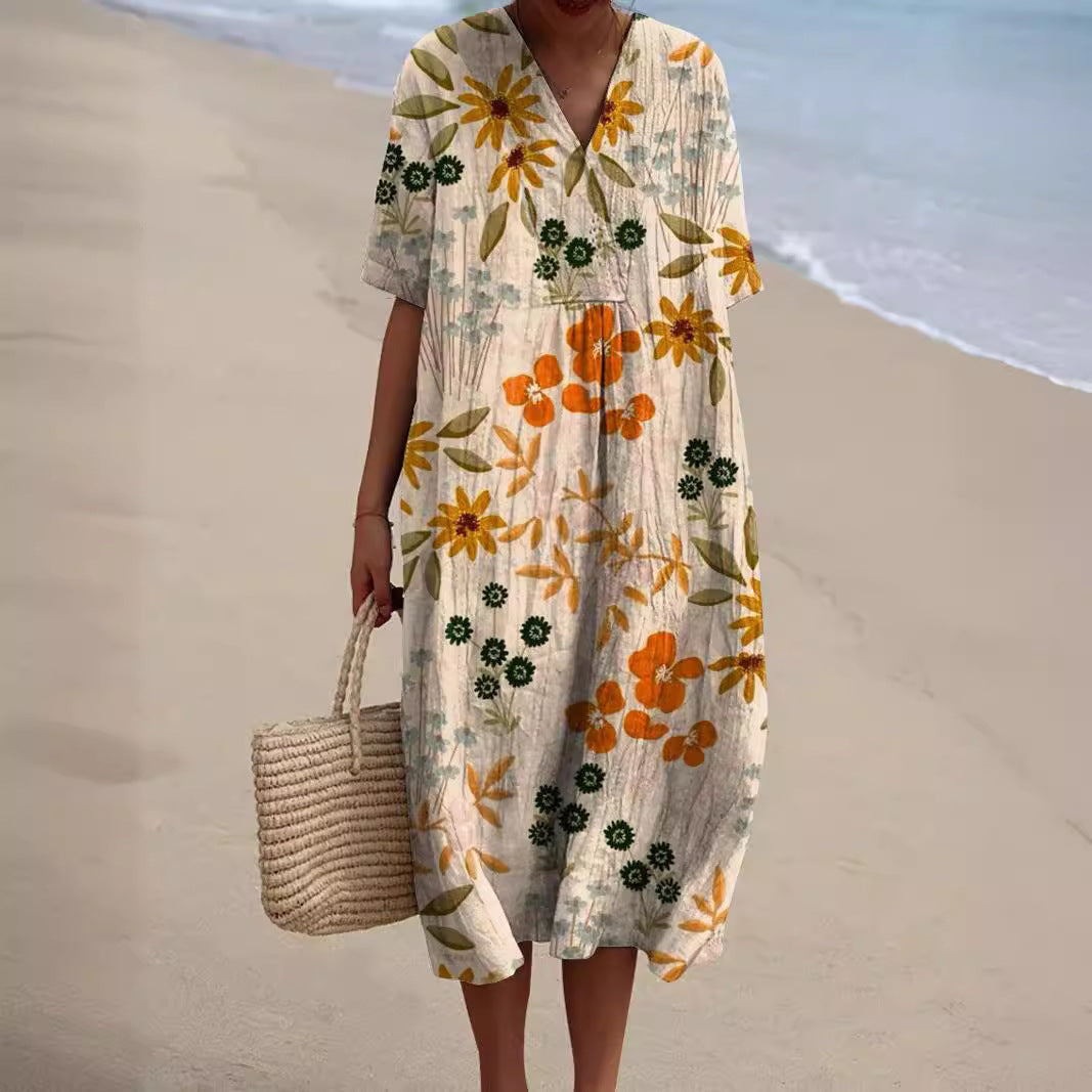 Robe florale éclatante Nicka de Danoir Paris avec motifs colorés et coupe fluide, portée élégante pour occasions estivales