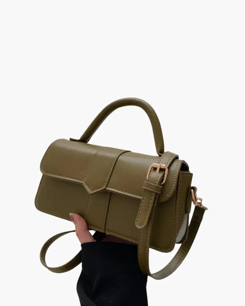 Sac à main The Paris Danoir Paris en cuir marron avec poches et poignées élégantes, vue de face.