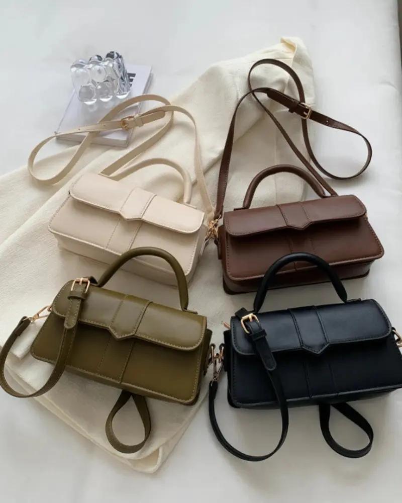 Sac à main Paris de Danoir Paris en brun avec poignées et détails élégants, vue de face.