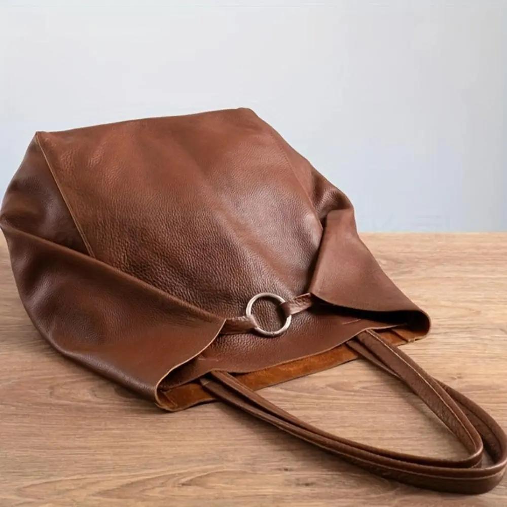 Grand sac à main vintage inspiré Renee de Danoir Paris, en cuir avec poignées épaisses et détail vintage élégant.