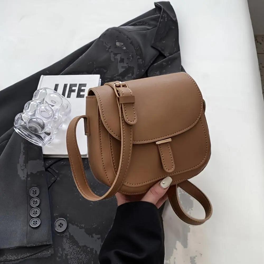 Sacoche de selle vintage Danoir Paris Sophie, style rétro avec fermeture élégante et détails en cuir, idéale pour vélo.