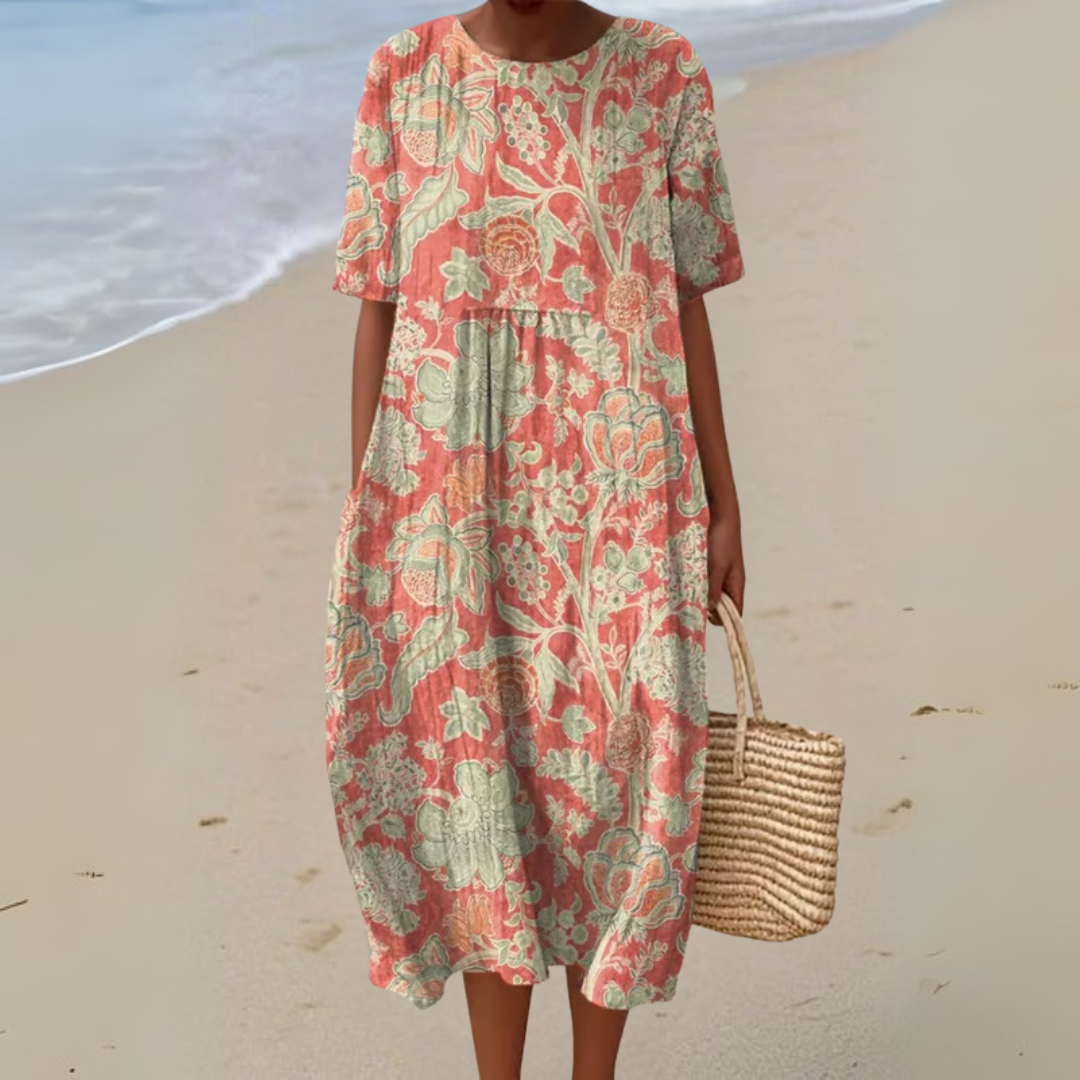 Robe vintage à fleurs Lisa de Danoir Paris, col rond sans manches, style élégant et féminin, tissu léger et coloré.