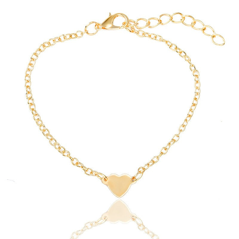 Bracelet doré Danoir Paris offert avec chaque commande, bijou élégant en or visible dans l'image.