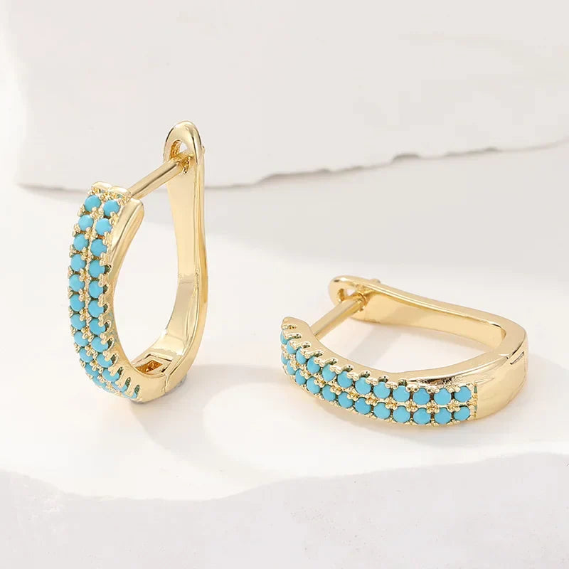 Boucles d'oreilles créoles classiques turquoise Danoir Paris, en argent avec finition polie.