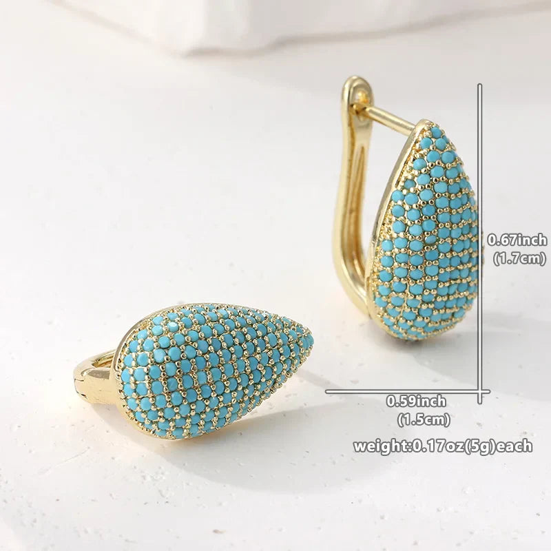 Boucles d'oreilles pendantes en turquoise en forme de goutte, marque Danoir Paris, élégantes et délicates.