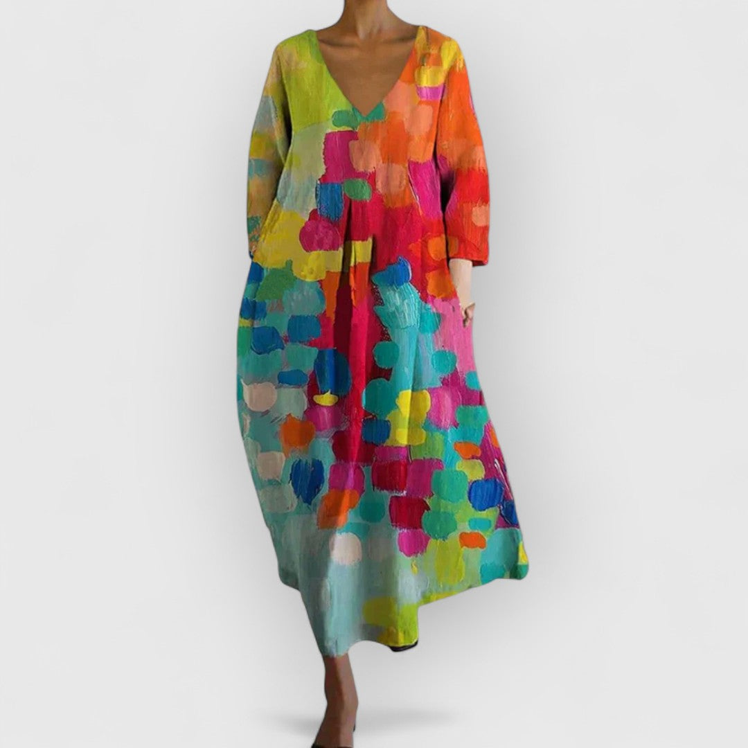 Robe à décolleté en V multicolore de la marque Danoir Paris, vêtement élégant pour femmes, en tissu fluide et coloré.