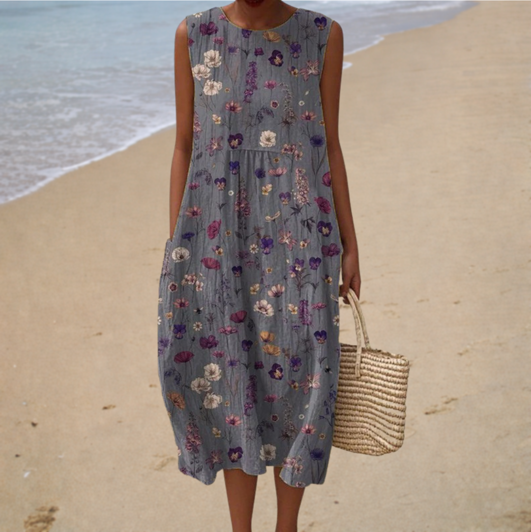 Robe midi champêtre Geneviève de Danoir Paris, élégante, en tissu léger, avec motifs floraux, portée décontractée et féminine.