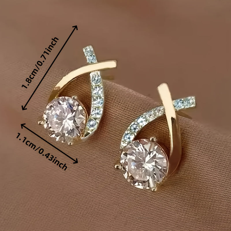 Boucles d'oreilles en puce Danoir Paris avec croix dorée et zirconiums, accessoire élégant et tendance pour oreilles.