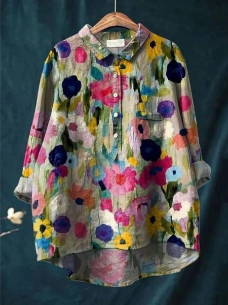 Blouse florale élégante Lila de Danoir Paris, tissu léger avec motifs floraux colorés, manches longues et coupe sophistiquée.