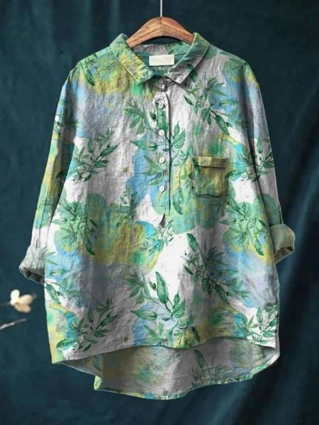 Blouse florale élégante Lila de Danoir Paris avec motifs fleuris, tissu léger et coupe sophistiquée.