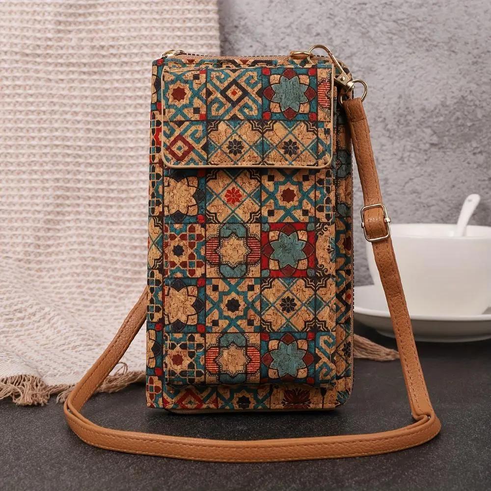 Sac à bandoulière boho-floral Nina de Danoir Paris avec motif floral et détails élégants.
