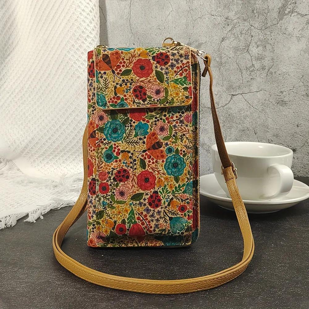 Sac à bandoulière Nina de Danoir Paris avec motif floral bohème, accessoire de mode élégant et coloré.