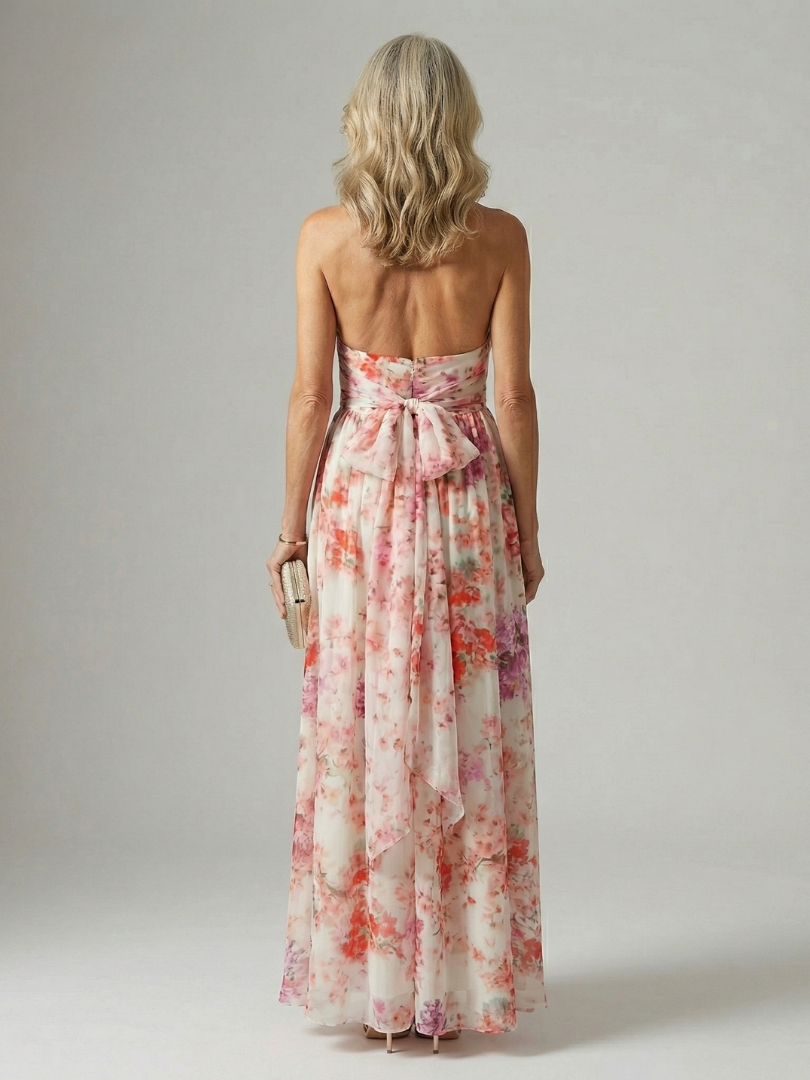 Robe longue fluide Elyon Danoir Paris avec motif floral, tissu léger et élégant, portée en été ou en occasion spéciale.