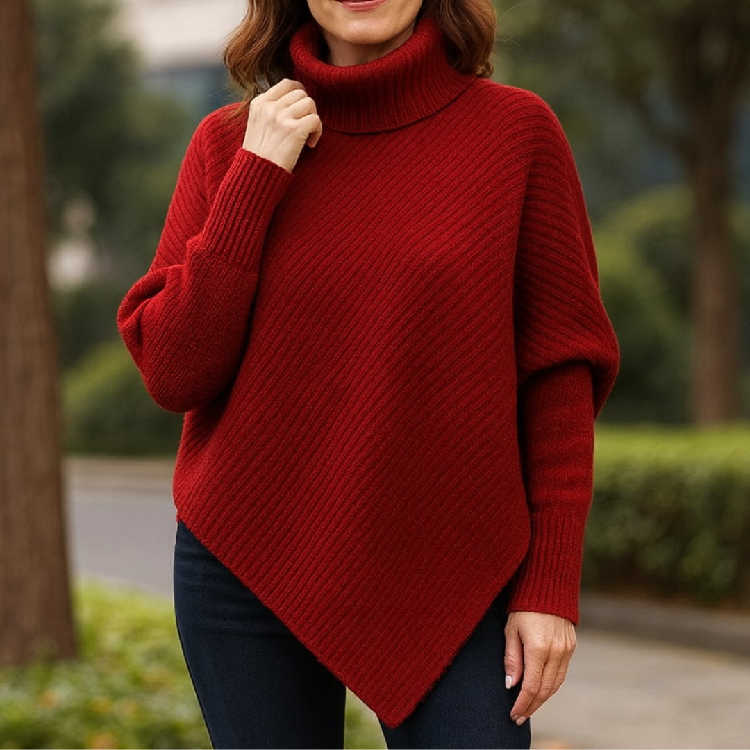 Pull poncho confortable Anneta de Danoir Paris en rouge, avec style décontracté et douceur visible.