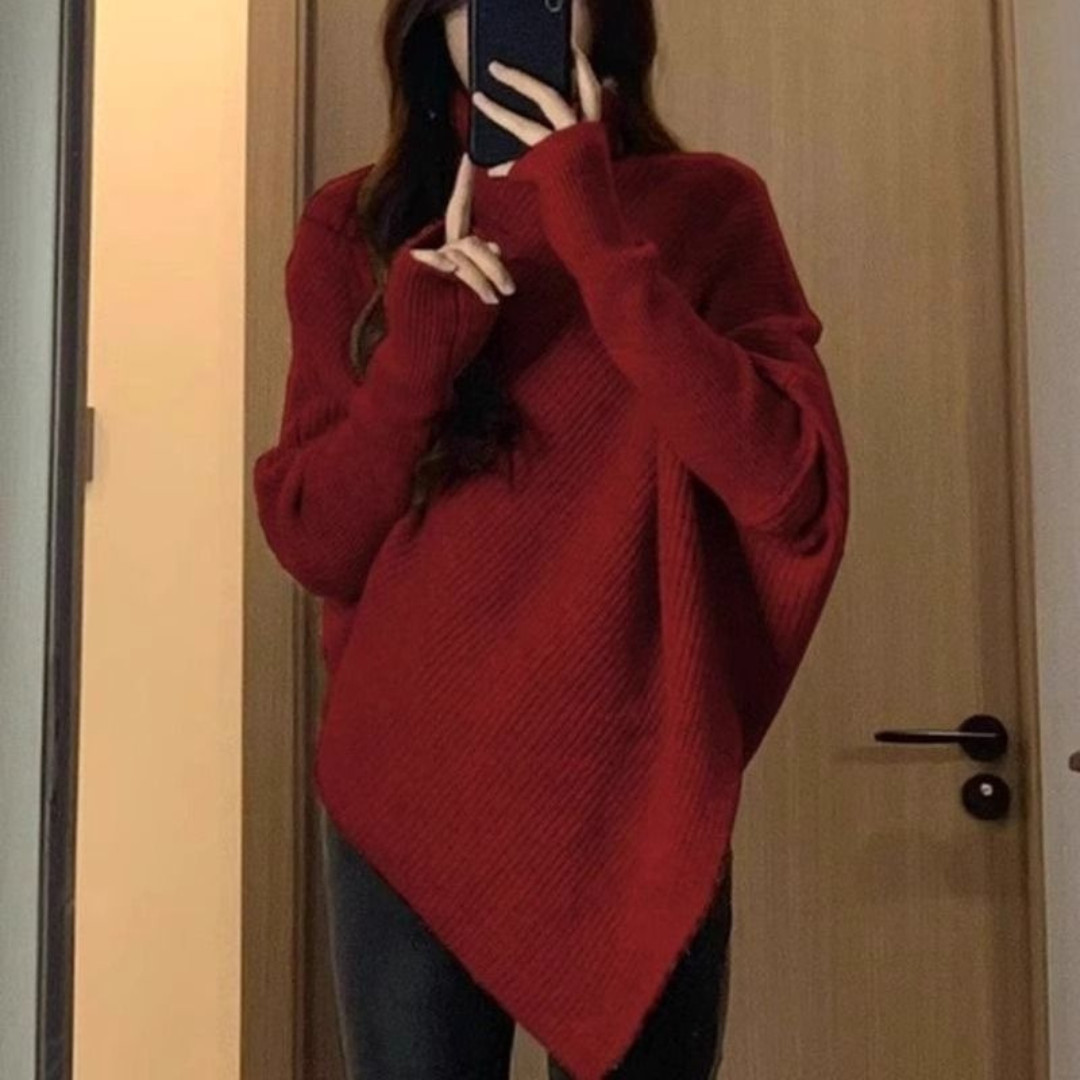 Pull poncho confortable Anneta de Danoir Paris en rouge, avec un style décontracté et chaud, pour un look élégant et cosy.