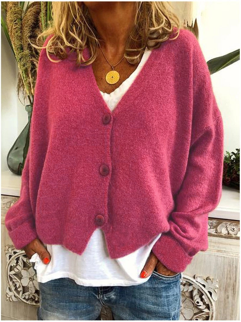 Cardigan élégant tricoté Scarlett de Danoir Paris en orange, douceur et style pour un look sophistiqué.