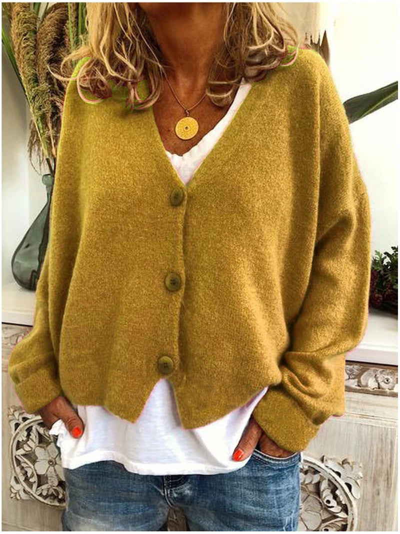 Cardigan tricoté orange Scarlett de Danoir Paris, élégant et classique, porté sur un mannequin.