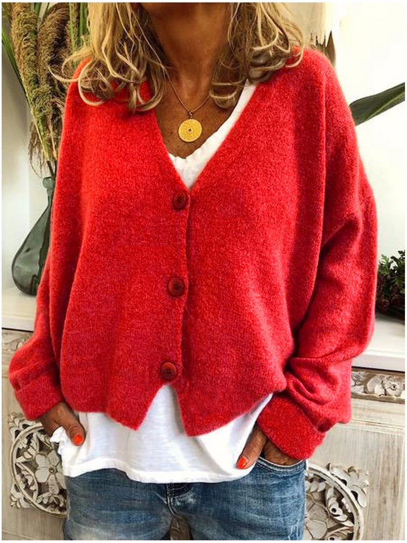 Cardigan tricoté élégant de la marque Danoir Paris, modèle Scarlett, en orange, porté en taille S.