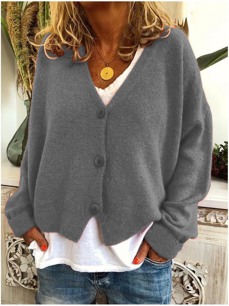 Cardigan tricoté élégant de Danoir Paris, modèle Scarlett FR1131, couleur orange, détails de tricot fin et style sophistiqué