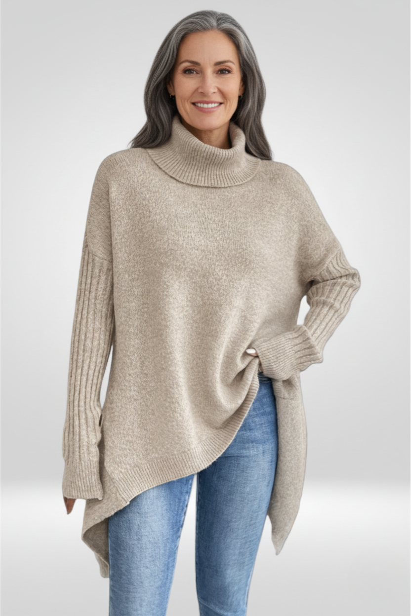 Pull asymétrique beige Danoir Paris Isabelle, style chic, porté sur mannequin, détail du col et coupe moderne.