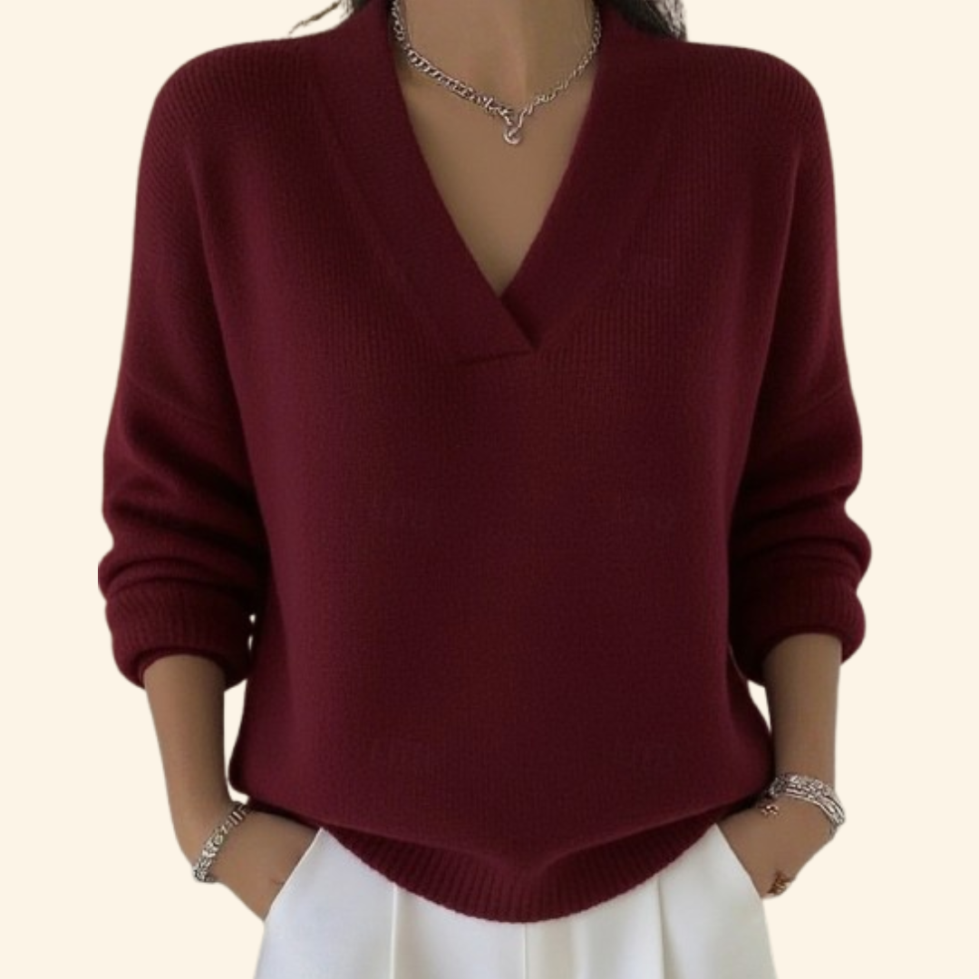 Pull Noor Danoir Paris rouge, élégant et confortable, en laine douce, porté avec col rond et manches longues.