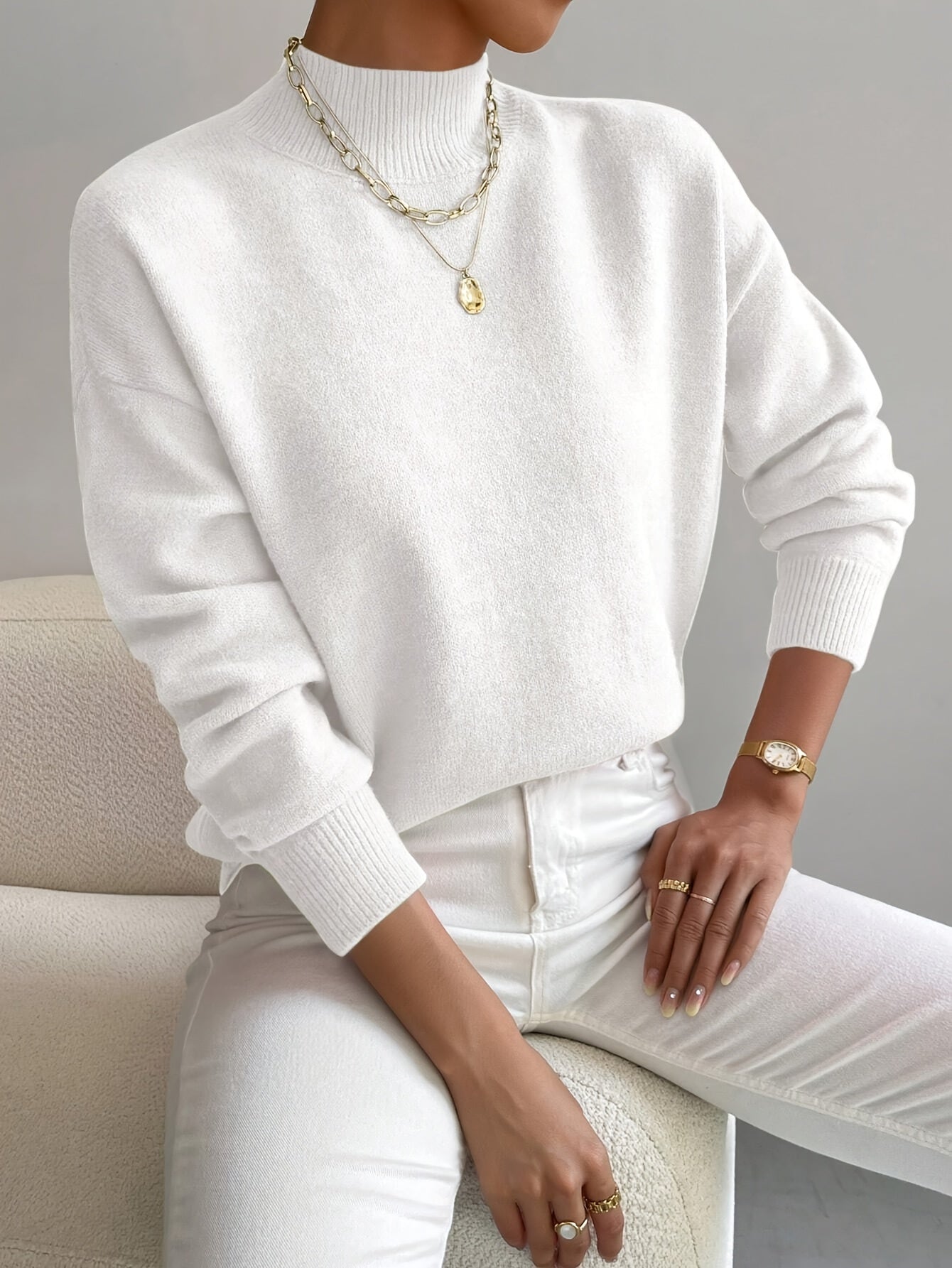 Pull rose clair Noëlle de Danoir Paris, chic et doux, en laine fine avec col rond et manches longues.