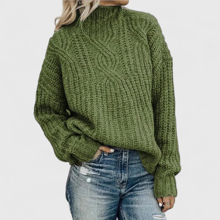 Pull torsadé vert Danoir Paris Lerynna, élégant, en coton doux, porté sur un mannequin, détail de la texture tordue visible.