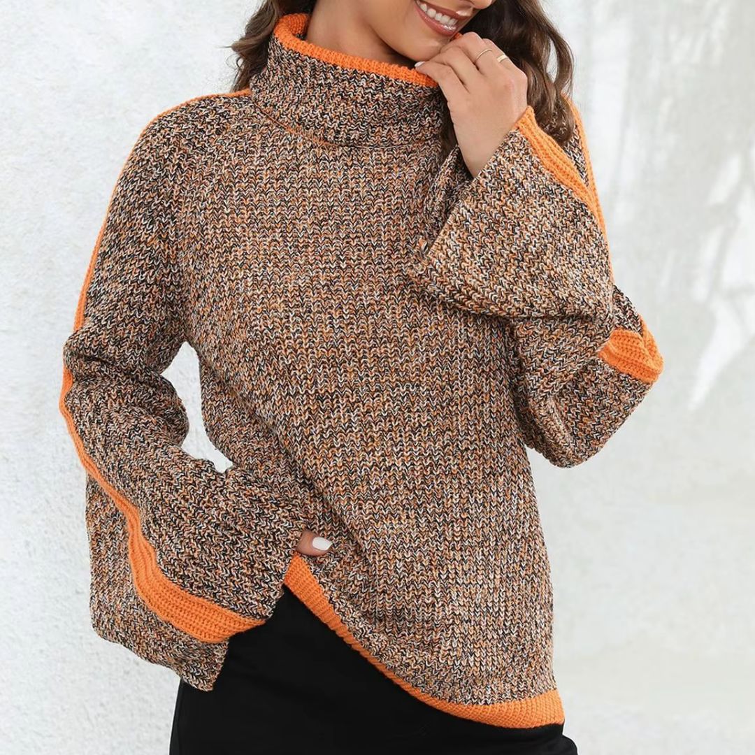 Pull patchwork chic orange Diana de Danoir Paris, modèle FR1408, doux et tendance, porté sur un fond neutre.