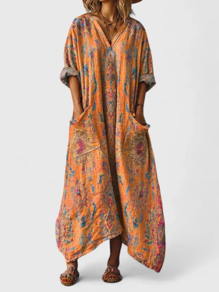 Robe élégante orange Thalyssira de Danoir Paris, style polyvalent, avec coupe fluide et détails sophistiqués.