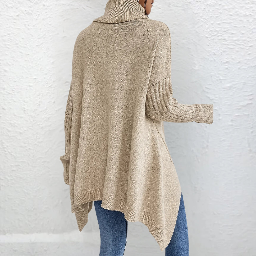 Pull polo élégant Brigitte de Danoir Paris en bleu, coupe ajustée, tissu doux et finition soignée, pour un style chic et confortable.