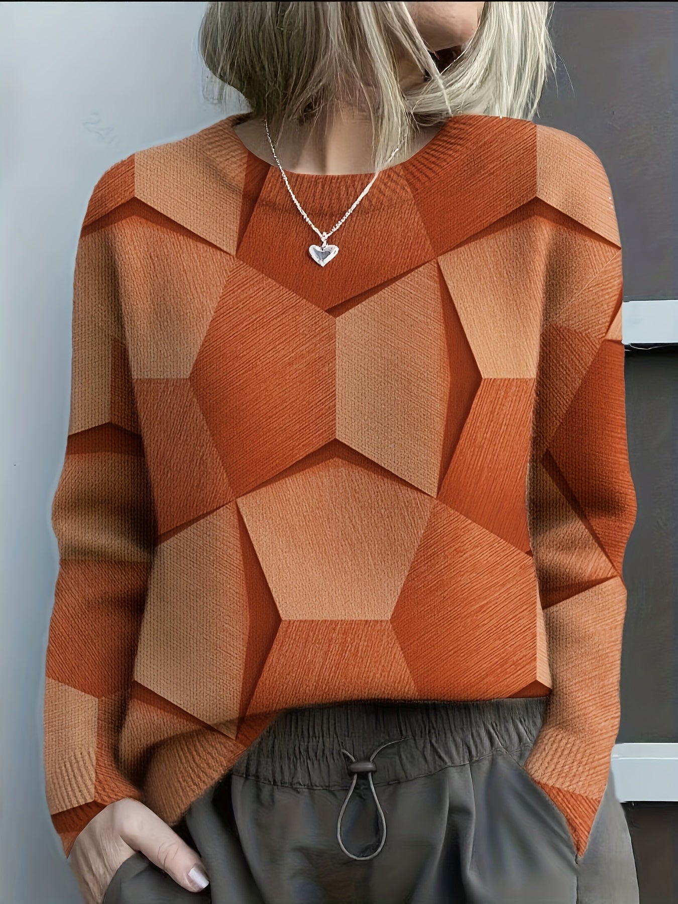 Sweat Lucia de Danoir Paris avec motif géométrique artistique en orange, taille S, vue de face.