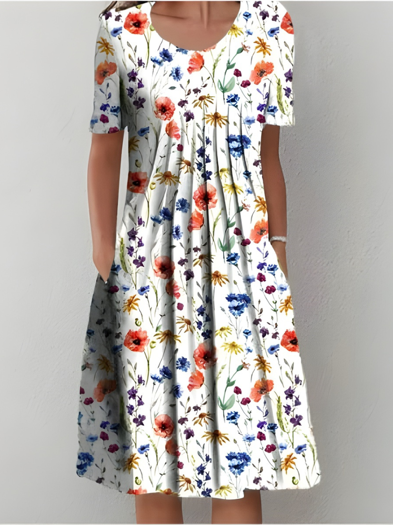 Robe plissée florale Cäcilia Danoir Paris en blanc avec motifs de fleurs rouges, vue de face, taille XS