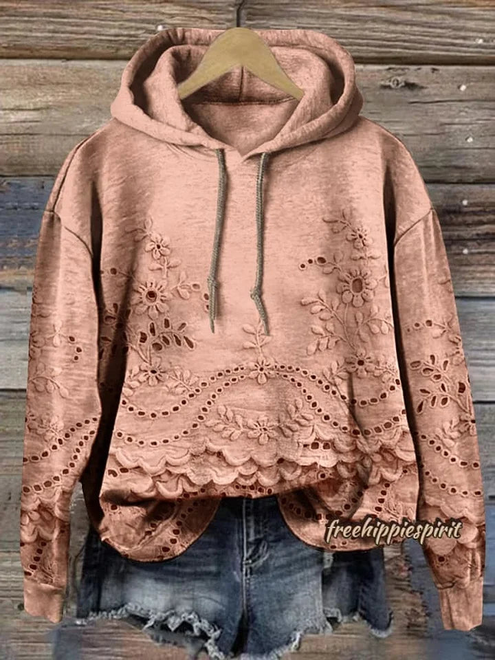 Sweat à capuche floral Amélie de Danoir Paris, modèle FR825, en rose avec motif floral, vue en gros plan sur le tissu.