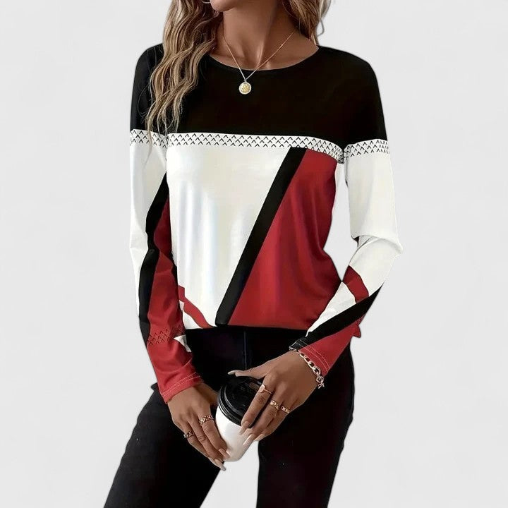 Haut graphique moderne Lena en FR925 de Danoir Paris, couleur rouge, en tissu élégant, porté par un mannequin.