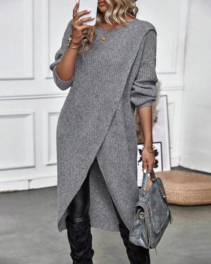 Pull long élégant Brigit de Danoir Paris, en gris, avec coupe fluide et détails raffinés, porté sur un fond neutre.