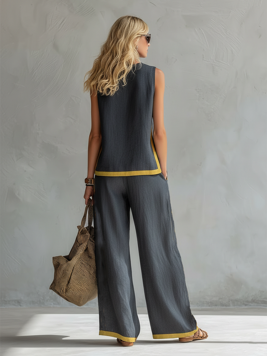 Ensemble deux pièces élégant gris Leila de Danoir Paris, comprenant un haut et un pantalon sophistiqués.