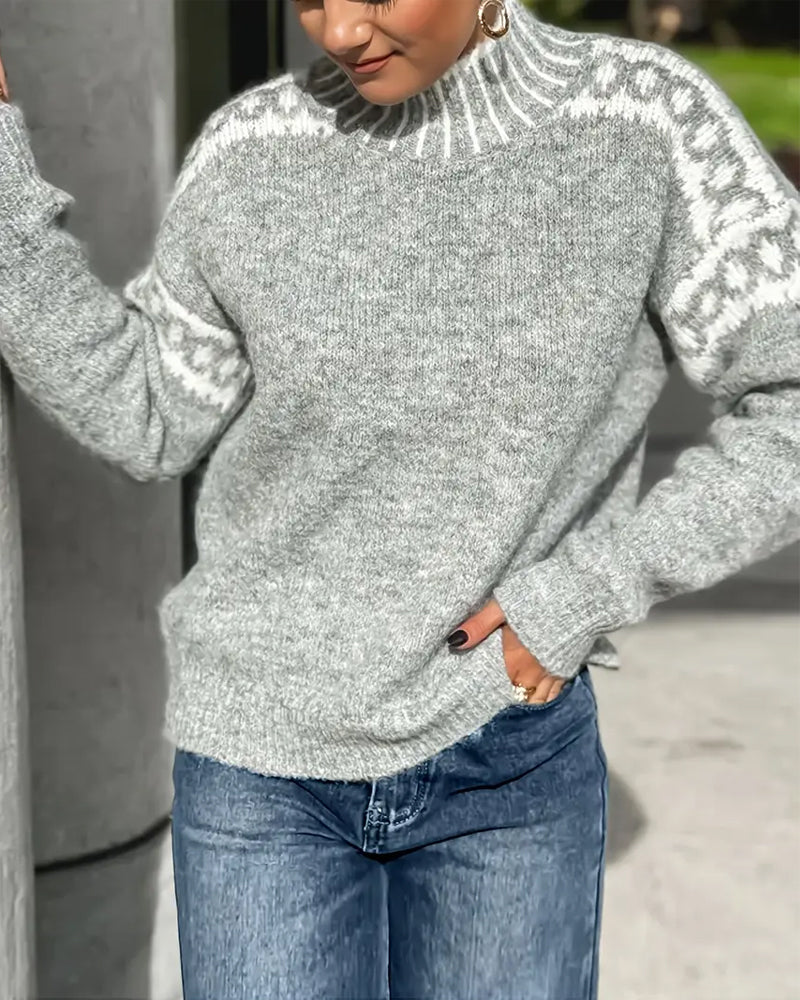 Pull maille gris Danoir Paris Elise™ élégant, détail en tricot fin et coupe sophistiquée visible sur l'image.
