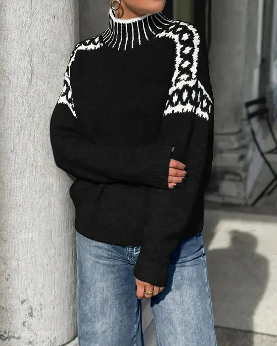 Pull maille gris élégant Elise™ de Danoir Paris, détail de la texture en laine et coupe sophistiquée.