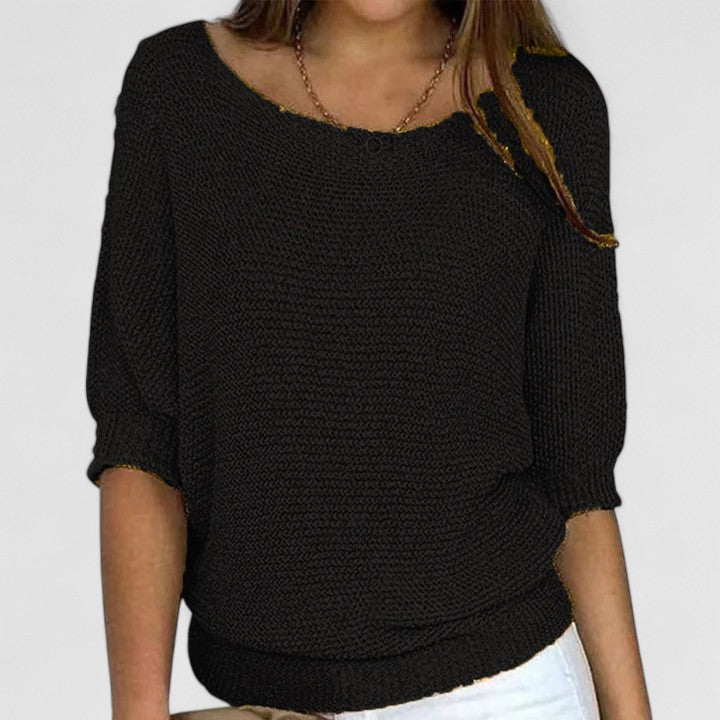 Pull en maille gris Rachel de Danoir Paris, coupe décontractée, tissu doux et confortable, porté seul ou avec d'autres vêtements.