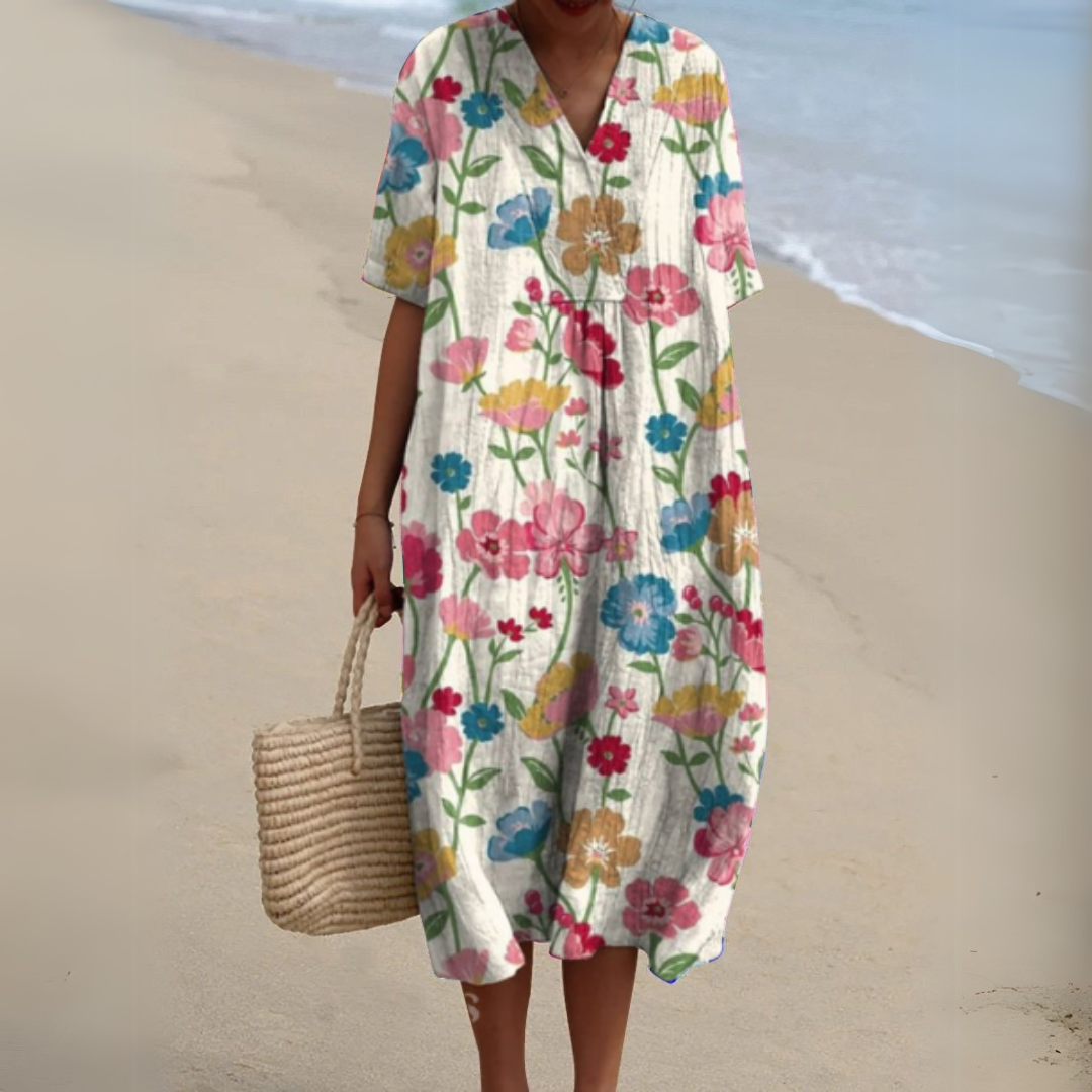 Robe fleurie élégante Nathalie de Danoir Paris, robe longue avec motif floral, tissu léger, style féminin et sophistiqué.